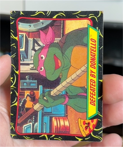 1989 Topps Teenage Mutant Ninja Turtles #94 Defeated By Donatello — front