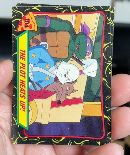 1989 Topps Teenage Mutant Ninja Turtles #104 The Plot Heats Up! — front