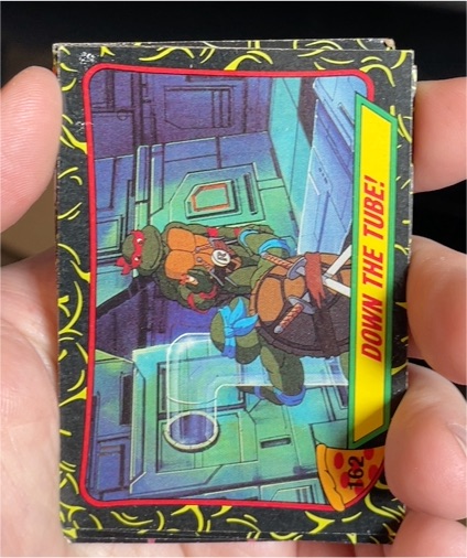 1989 Topps Teenage Mutant Ninja Turtles #162 Down the Tube — front