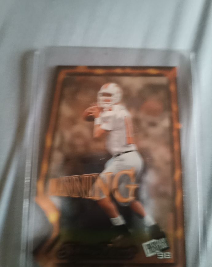 1998 Press Pass Triple Threat #TT3 Peyton Manning — front
