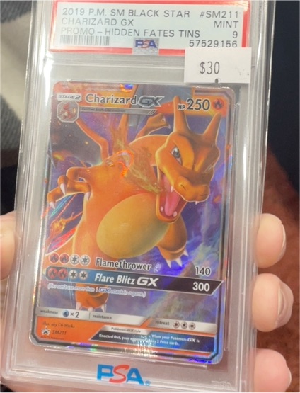 2019 Pokemon SM Black Star Promo #SM211 Charizard GX — front