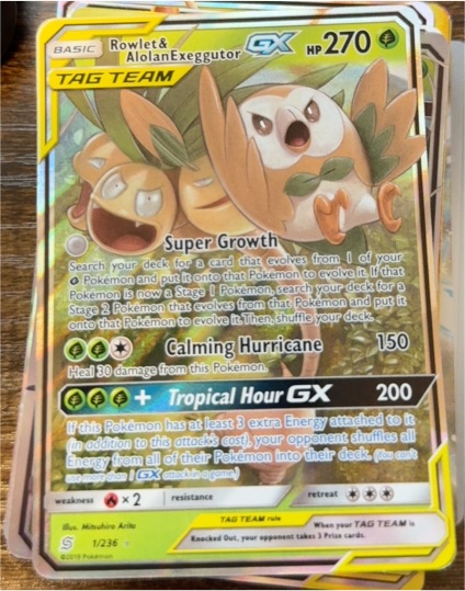 2019 Pokémon Unified Minds #1 Rowlet & Alolan Exeggutor GX — front