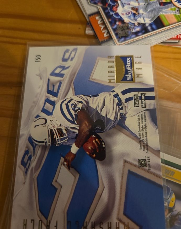 1995 SkyBox Premium #150 Marshall Faulk / Barry Sanders — front