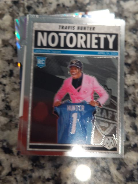 2025 Panini Mosaic Notoriety #12 Travis Hunter — front