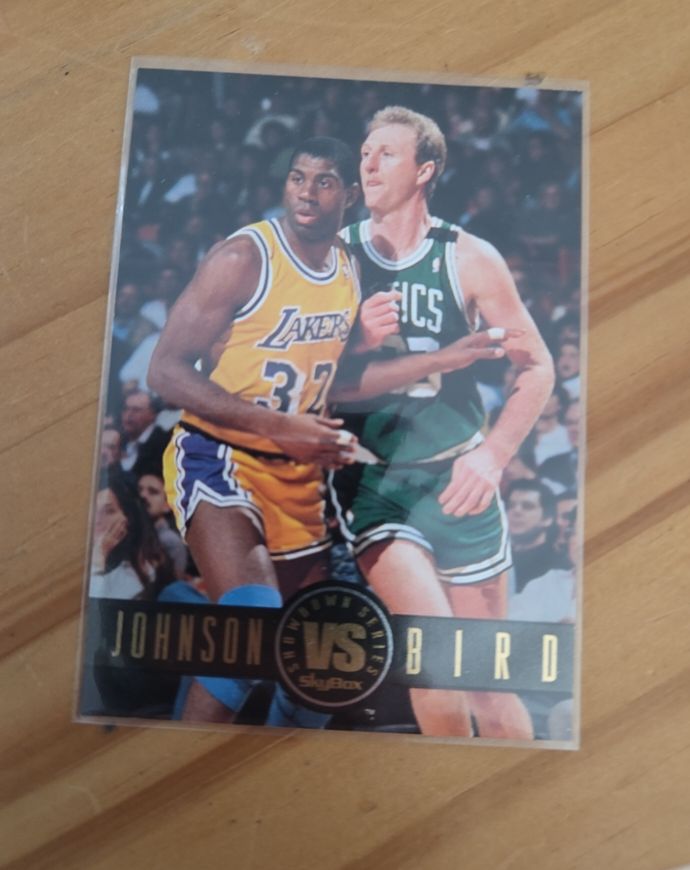 1993-94 SkyBox Premium #SS12 Magic Johnson vs Larry Bird — front