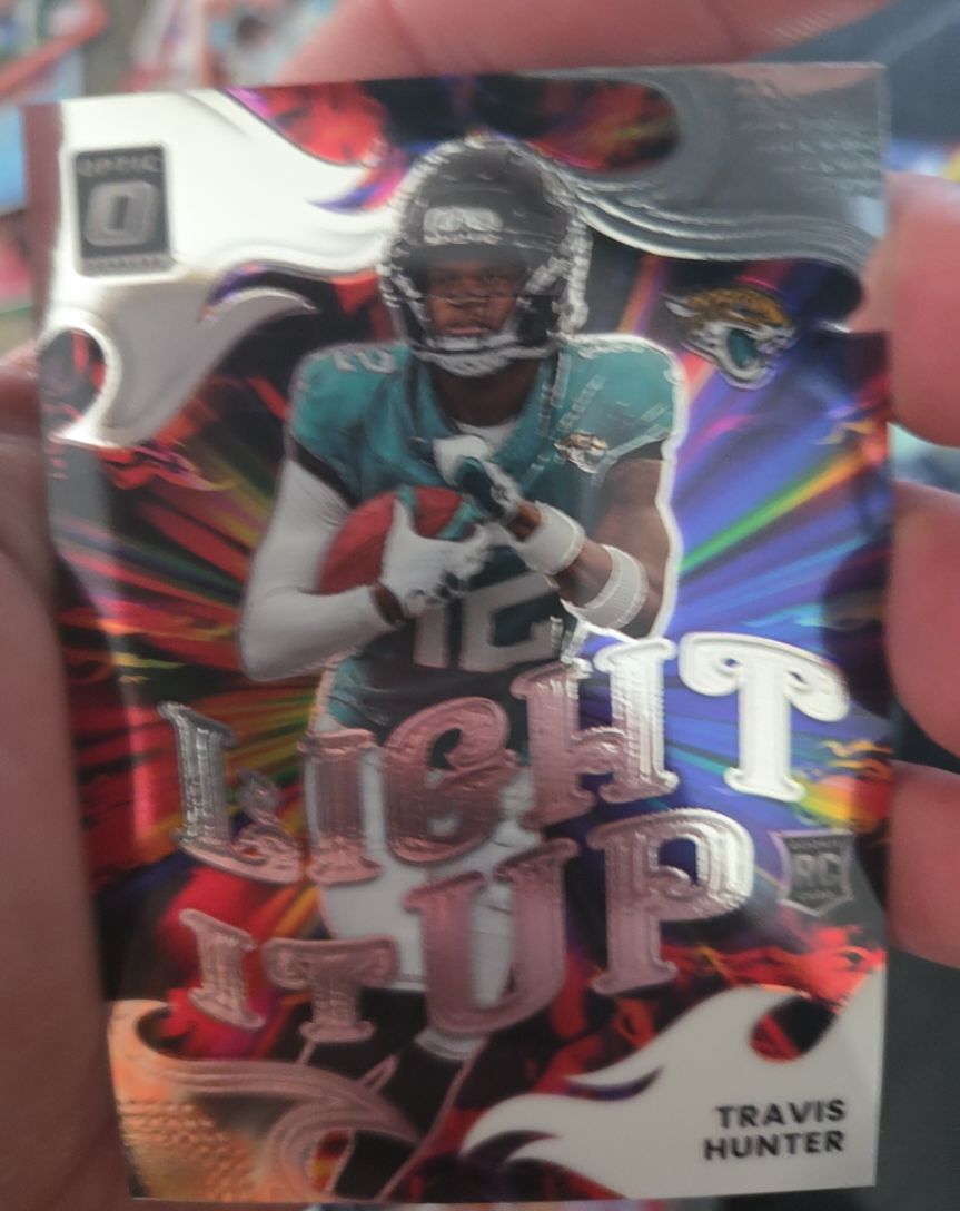2025 Panini Donruss Optic #4 Travis Hunter Light It Up Ice Prizm — front