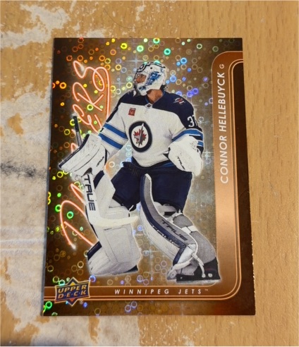 2024-25 Upper Deck Series 1 Dazzlers Orange #DZ-48 Connor Hellebuyck — front
