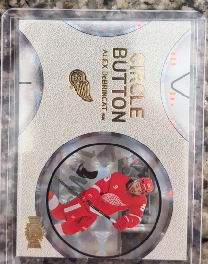 2025-26 Upper Deck Skybox Metal Universe #CB-7 Alex DeBrincat Circle Button — front