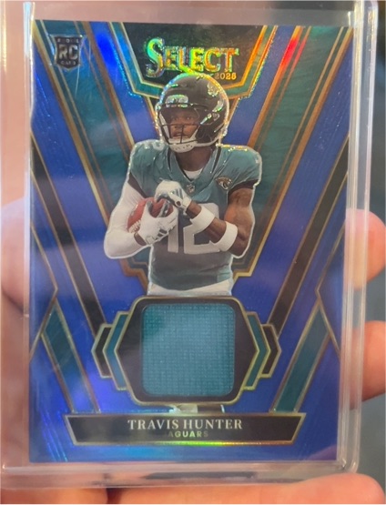 2025 Panini Select #RSW-THR Travis Hunter Rookie Swatches Blue Prizm Patch — front