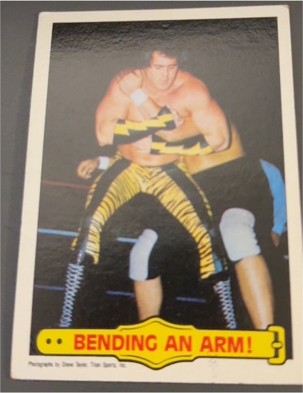 1985 Topps WWF #41 Bending An Arm! Brutus Beefcake — front
