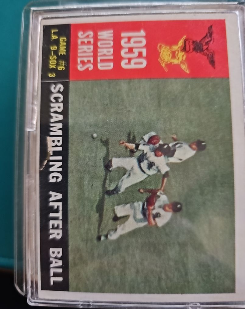 1960 Topps #390 1959 World Series Scrambling After Ball — front