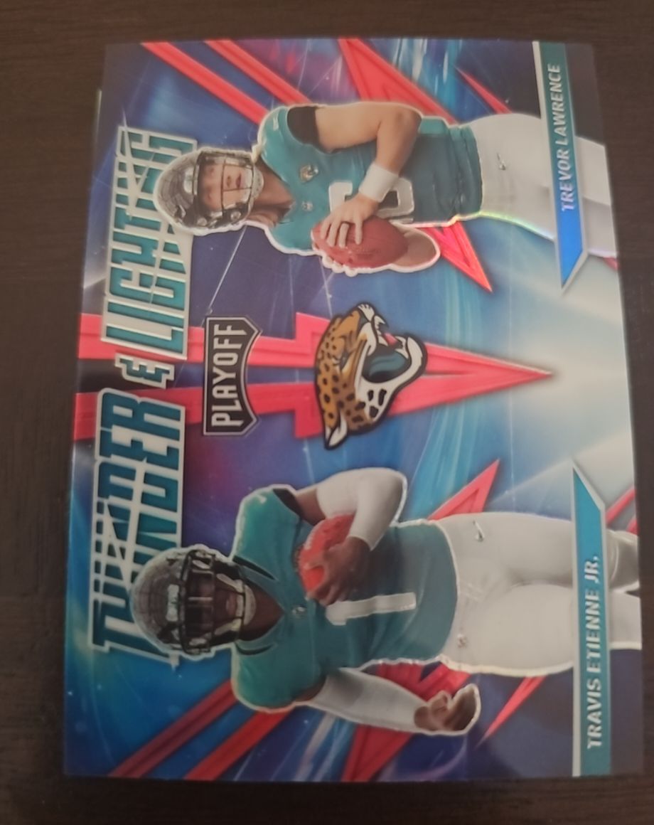 2021 Panini Playoff Thunder and Lightning #TL-17 Trevor Lawrence / Travis Etienne Jr. — front