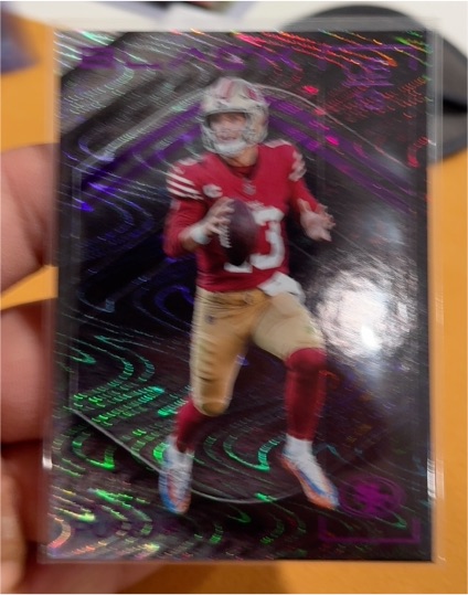 2025 Panini Black #24 Brock Purdy — front