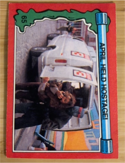 1991 Topps Teenage Mutant Ninja Turtles II #65 April Held Hostage — front