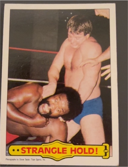 1985 Topps WWF #40 Strangle Hold! Rowdy Roddy Piper & Junkyard Dog — front