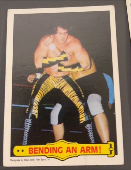 1985 Topps WWF #41 Bending An Arm! Brutus Beefcake — front