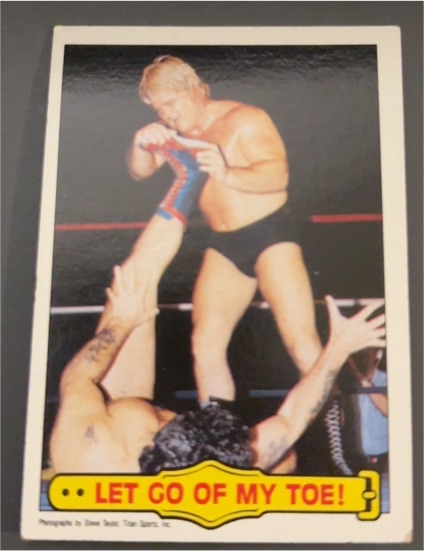 1985 Topps WWF #22 Let Go of My Toe! Greg "The Hammer" Valentine — front