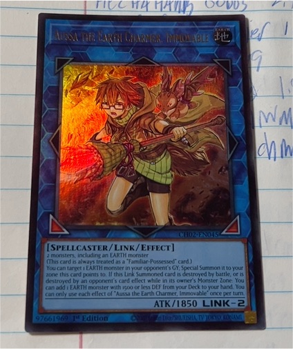 Yu-Gi-Oh! CH02-EN045 Aussa the Earth Charmer, Immovable — front