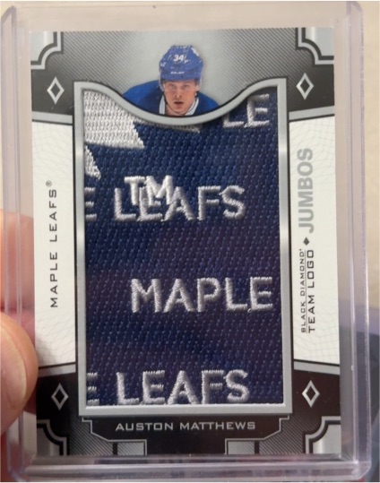 2022-23 Upper Deck Black Diamond Team Logo Jumbos #TL-AU Auston Matthews — front