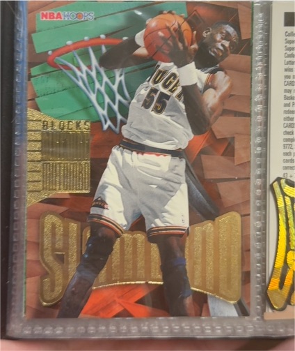 1995-96 Hoops Slamland #SL12 Dikembe Mutombo — front
