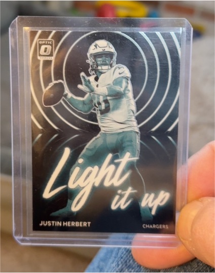 2022 Panini Donruss Optic #LU-4 Justin Herbert Light It Up — front