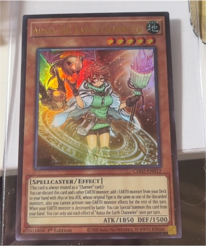 Yu-Gi-Oh! CH02-EN012 Aussa the Earth Channeler — front