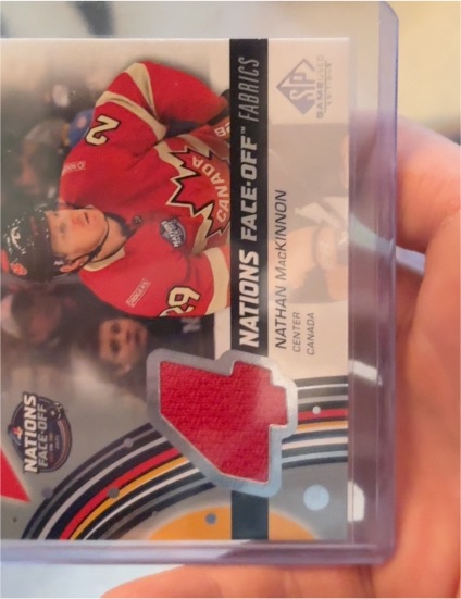 2025-26 Upper Deck SP Game Used 4 Nations Face-Off Fabrics #4N-MA Nathan MacKinnon — front