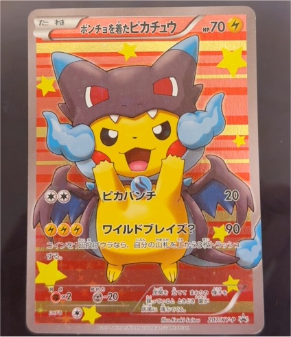 2016 Pokémon XY Promo #207 Poncho-Wearing Pikachu Mega Charizard X — front