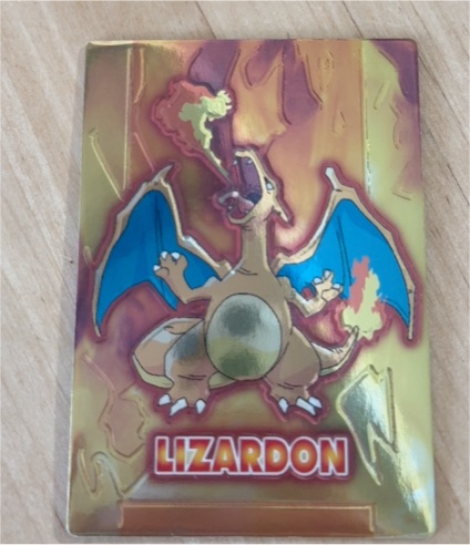 1999 Meiji Get Card Charizard Embossed Promo — front