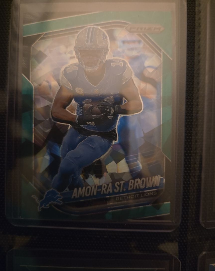 2023 Panini Prizm Emergent #H-8 Amon-Ra St. Brown — front