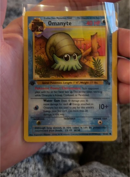 1999 Pokémon Fossil #52 Omanyte — front