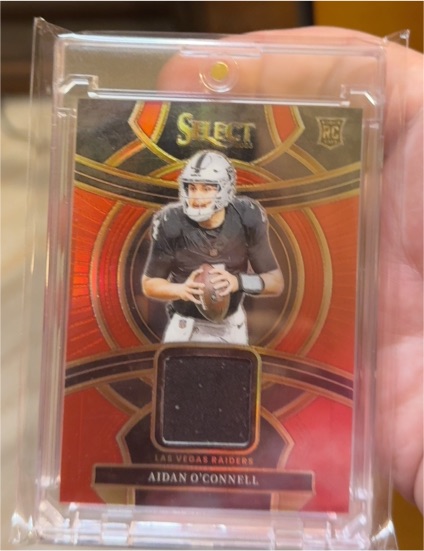 2023 Panini Select Rookie Swatches Red Prizm #RSW-AOC Aidan O'Connell — front