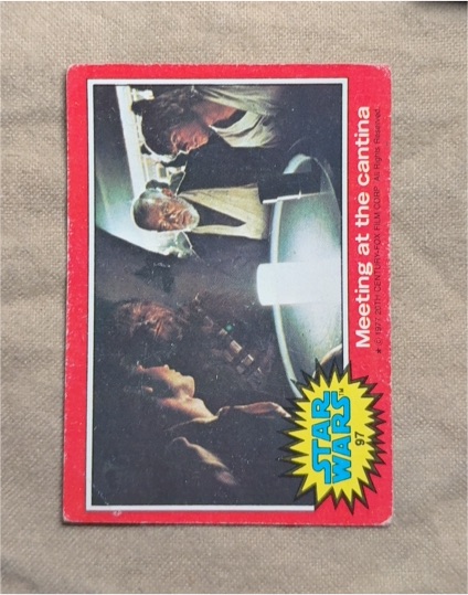 1977 Topps Star Wars Red Series 2 #97 Meeting at the Cantina — front