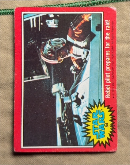 1977 Topps Star Wars #84 Rebel pilot prepares for the raid! — front