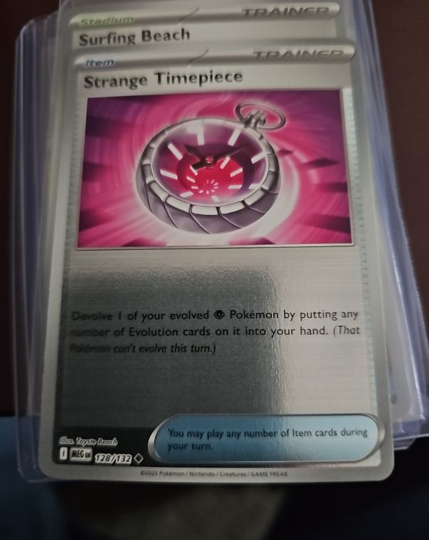 2023 Pokémon MEG #128 Strange Timepiece — front