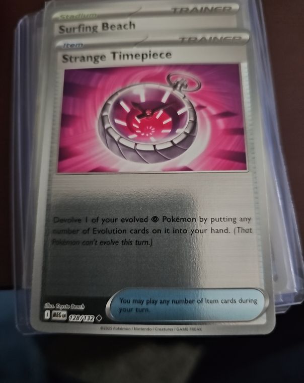 2023 Pokémon MEG #128 Strange Timepiece — front