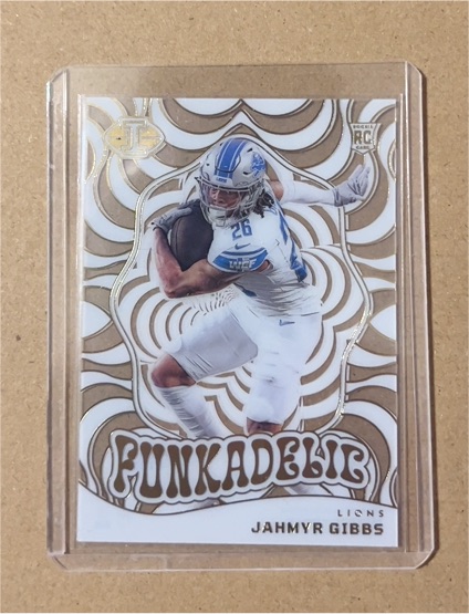 2023 Panini Illusions #15 Funkadelic Jahmyr Gibbs Rookie Insert — front