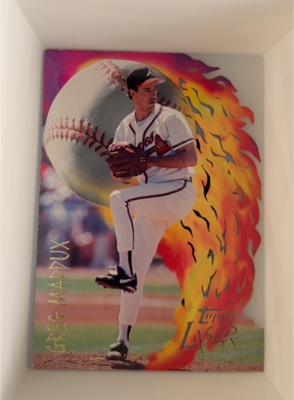1996 Topps Laser #121 Greg Maddux — front