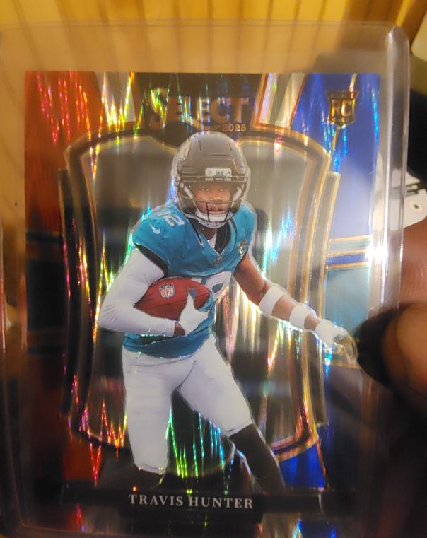 2025 Panini Select #128 Travis Hunter Premier Level Red & Blue Shock Prizm — front
