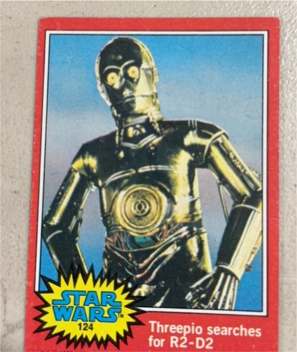 1977 Topps Star Wars #124 Threepio searches for R2-D2 — front