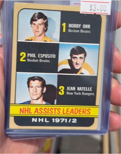 1971-72 Topps #62 NHL Assist Leaders Bobby Orr Phil Esposito Jean Ratelle — front