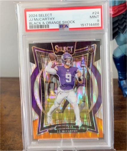 2024 Panini Select #24 J.J. McCarthy Black & Orange Shock — front