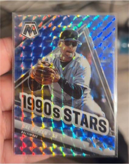 2022 Panini Mosaic #295 Cal Ripken Jr. 1990's Stars Blue Camo — front