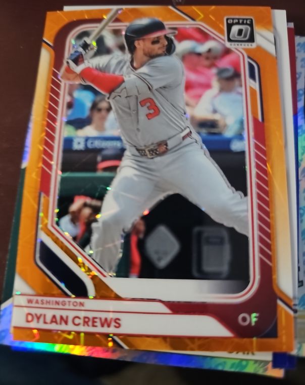 2025 Panini Donruss Optic #54 Dylan Crews Orange Velocity Prizm — front