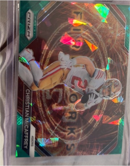 2023 Panini Prizm #F-12 Christian McCaffrey Fireworks Green Wave — front