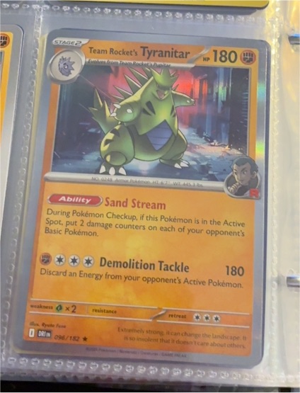 2023 Pokemon Center Destined Rivals #096 Team Rocket's Tyranitar — front