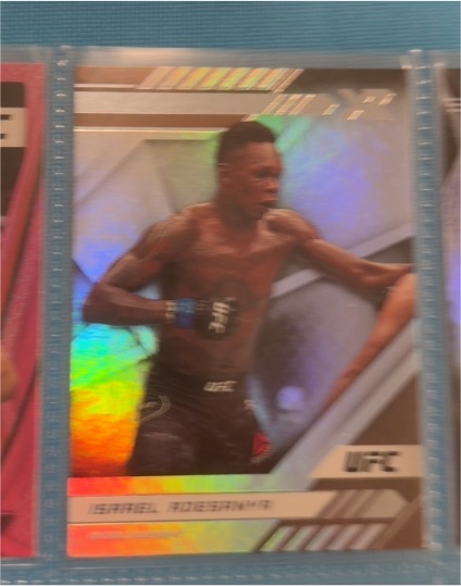 2021 Panini Chronicles UFC XR #195 Israel Adesanya Pink Foil — front