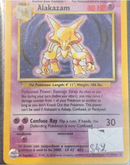 1999 Pokémon Base Set 1/102 Alakazam Holo Rare — front