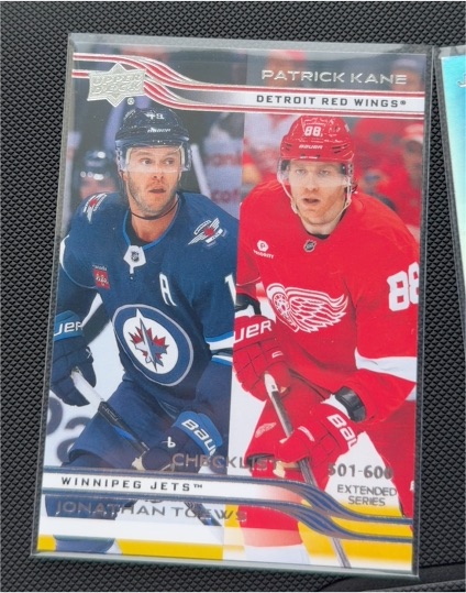 2025-26 Upper Deck Extended Series #699 Patrick Kane Jonathan Toews — front