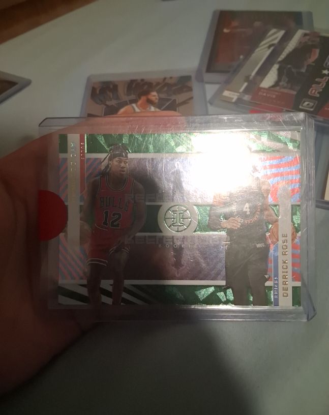 2021-22 Panini Illusions #17 Derrick Rose / Ayo Dosunmu Rookie Reflections Emerald — front